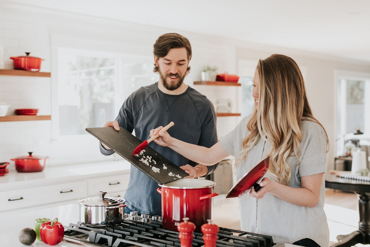 Professional kitchen cleaning with organized supplies on counter